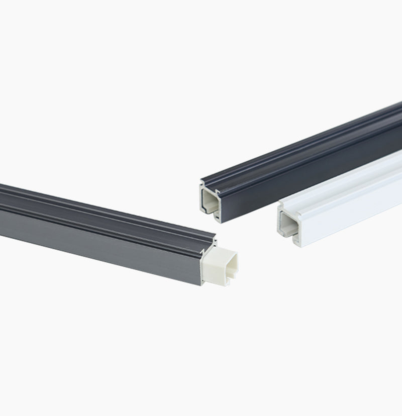 Custom heavy duty metal curtain tracks in dark grey & white, showing internal profiles & end cap for magnetic closing.