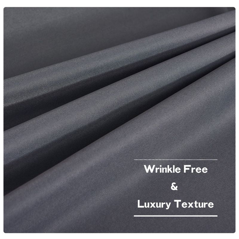 Close-up of dark grey waterproof outdoor canvas curtain fabric, showcasing its wrinkle-free and luxury texture for patios.
