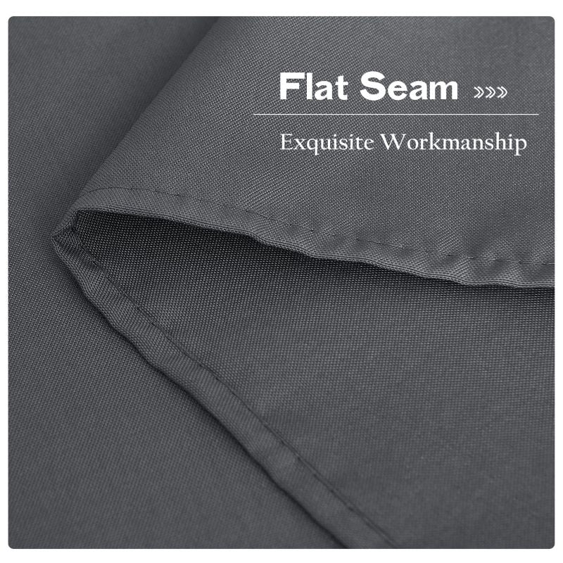 Close-up of the flat seam and exquisite stitching on a grey waterproof outdoor canvas curtain, showcasing quality workmanship for patio use.