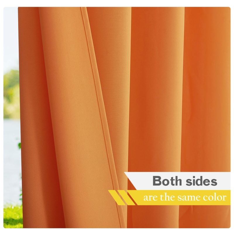 Close-up of orange waterproof outdoor canvas patio curtain, showing both sides are the same vibrant color.