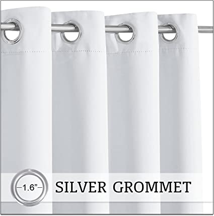 Close-up of a white waterproof outdoor patio curtain panel, featuring multiple 1.6-inch silver grommets on a hanging rod.