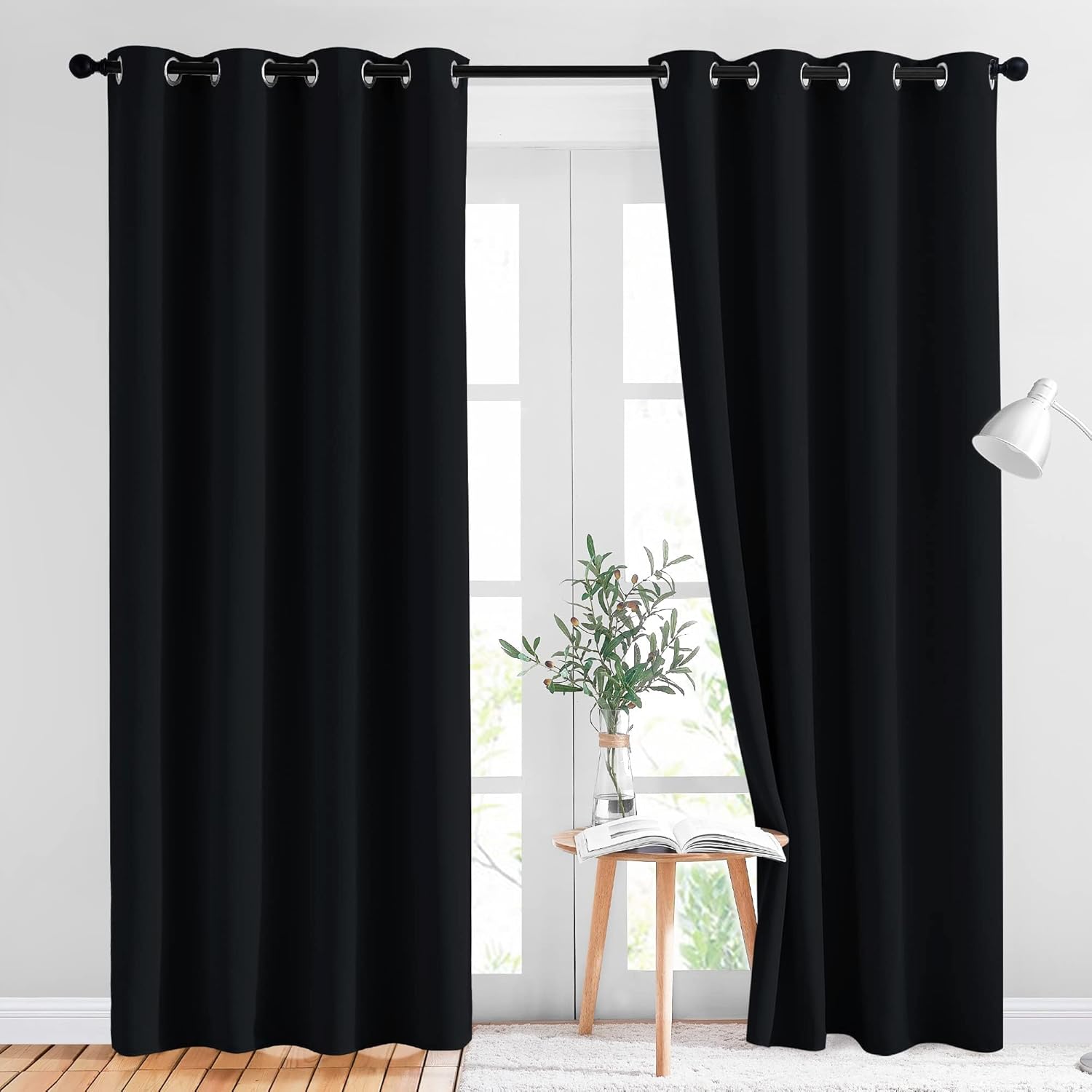 KGORGE black blackout curtain samples with grommets, installed on a window for ultimate room darkening and privacy.
