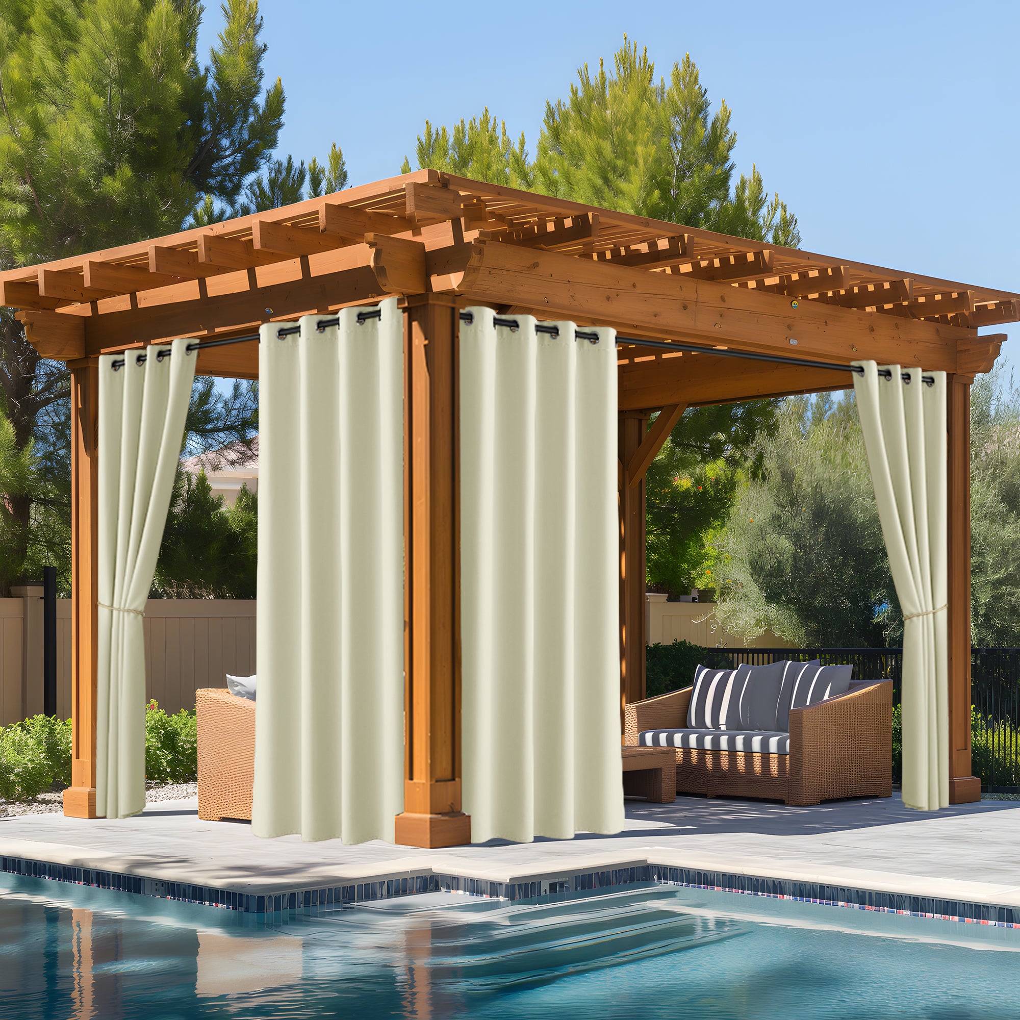 Cream weatherproof outdoor curtains on a wooden pergola next to a pool, creating a private oasis for outdoor living.