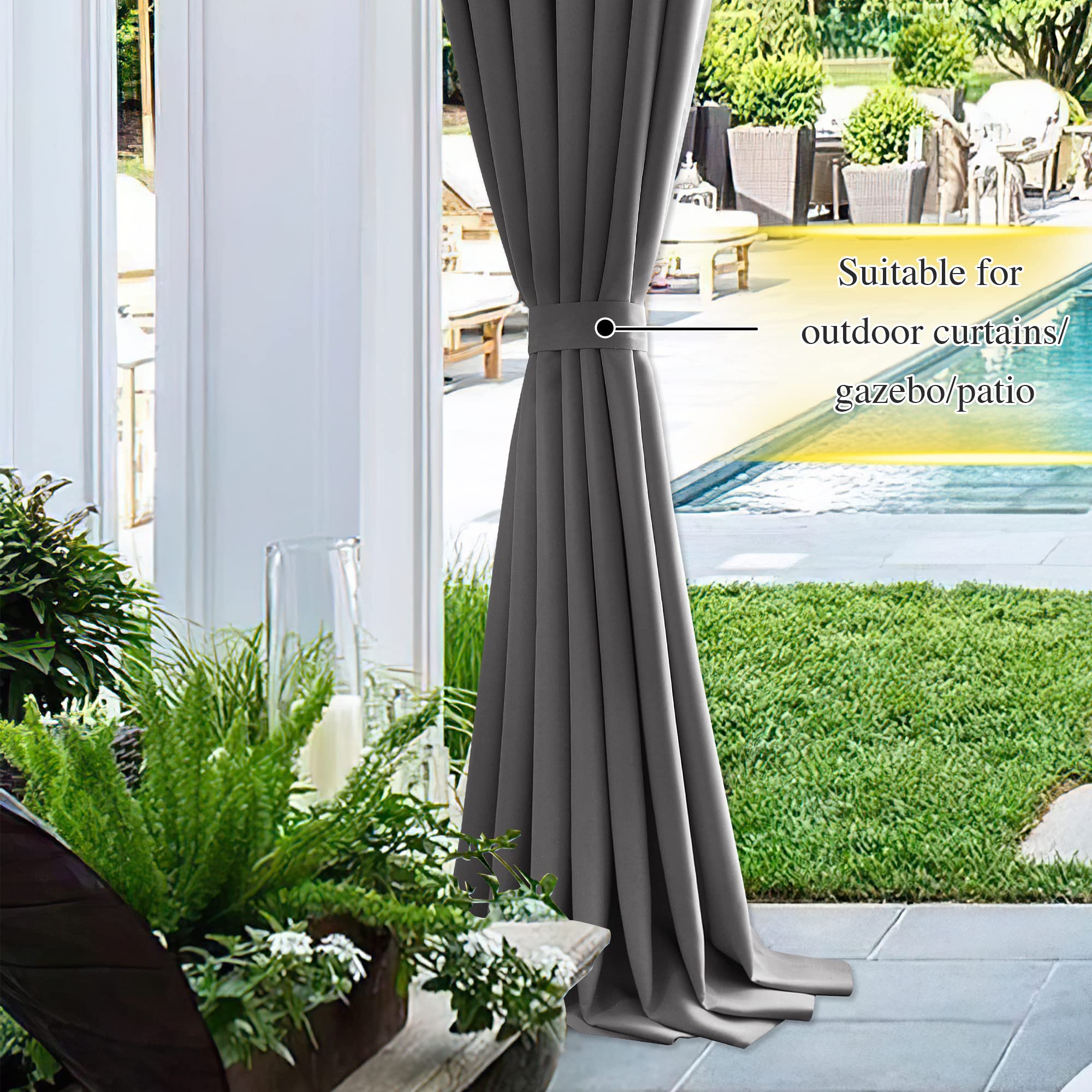 Dark gray weatherproof outdoor curtain stylishly tied back with a magnetic drape tie-back, overlooking a patio pool area.