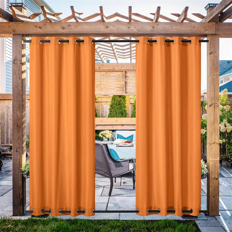 KGORGE orange outdoor canvas curtains on a pergola, creating a private patio oasis with stylish shade.