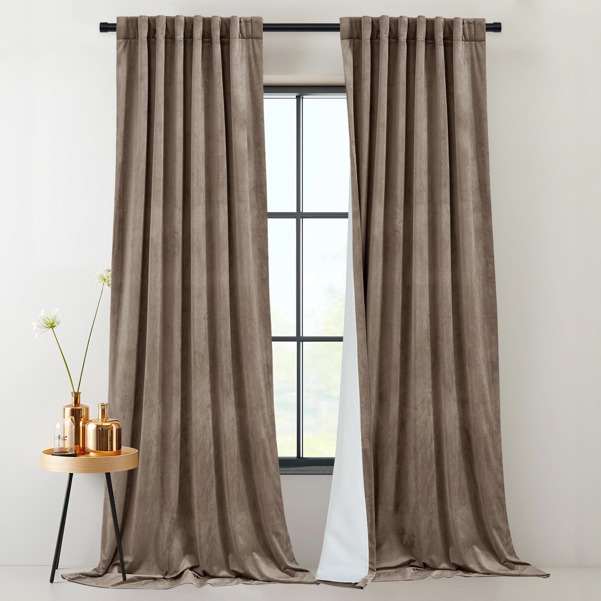 Two thick, 2-layer brown velvet thermal insulated curtains with rod pocket & back tab style, effectively blocking light.