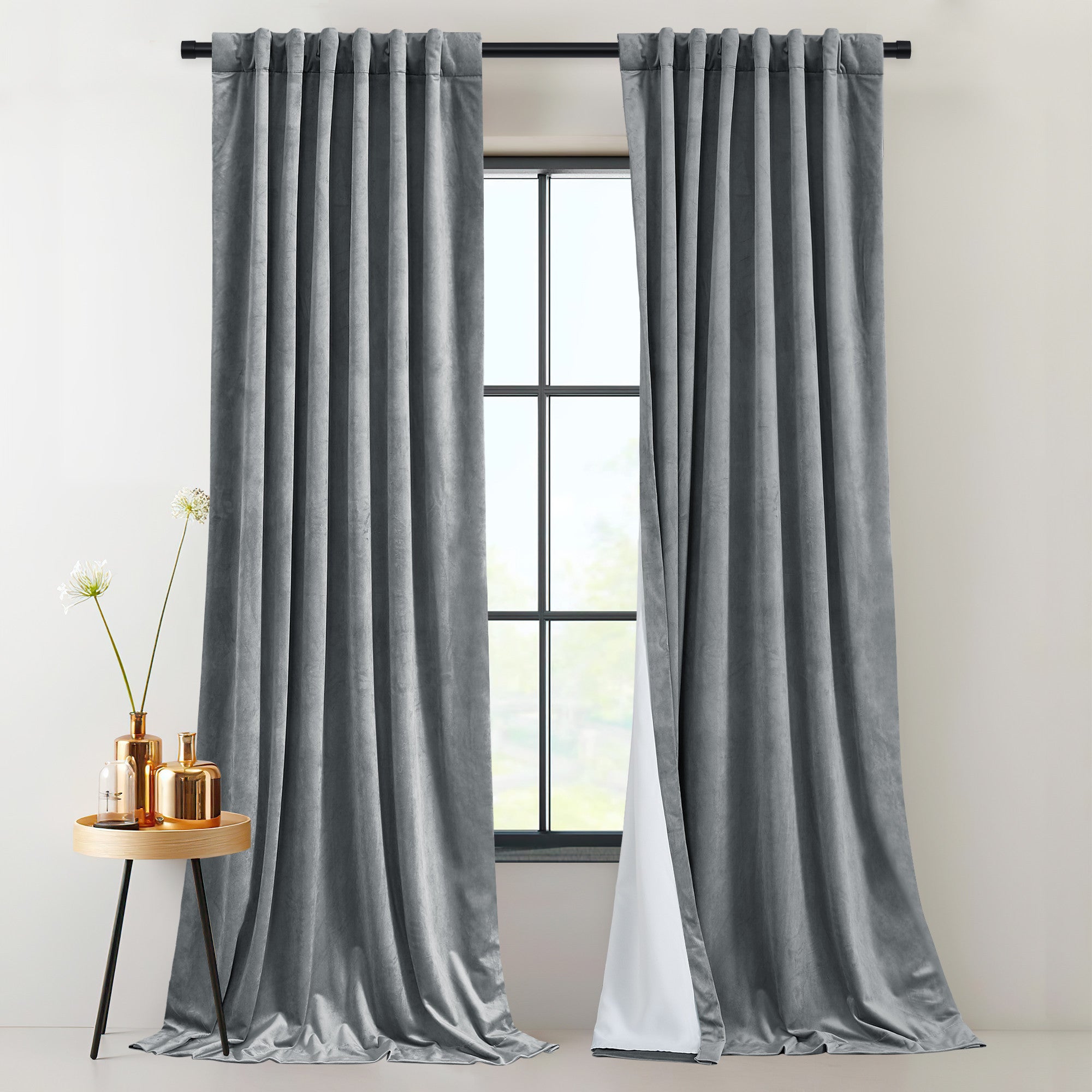 Plush gray velvet drapes with thermal insulated, light blocking layers, featuring rod pocket & back tab hanging style.