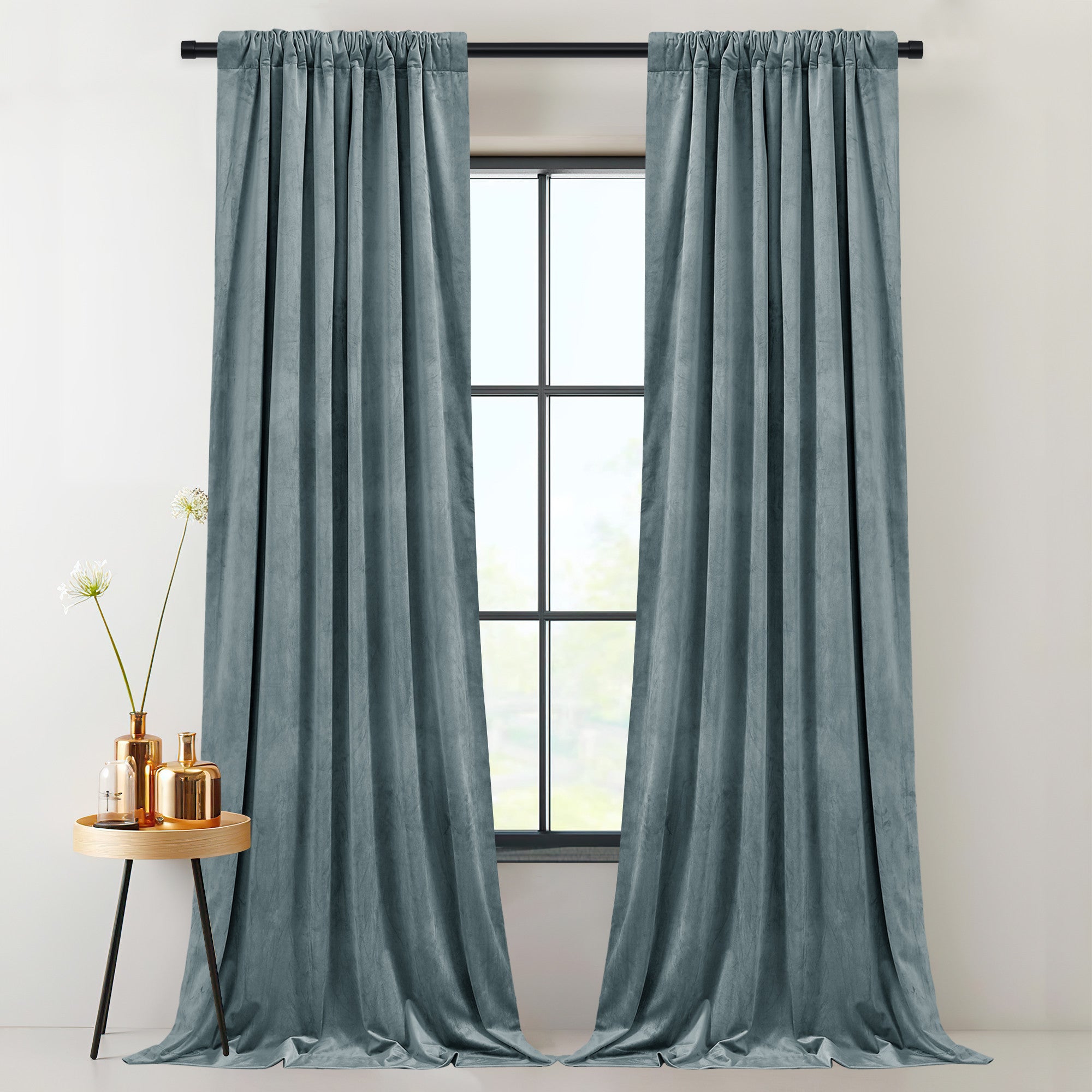 Elegant two-panel blue velvet thermal insulated light blocking drapes with rod pocket style, providing privacy and shade.