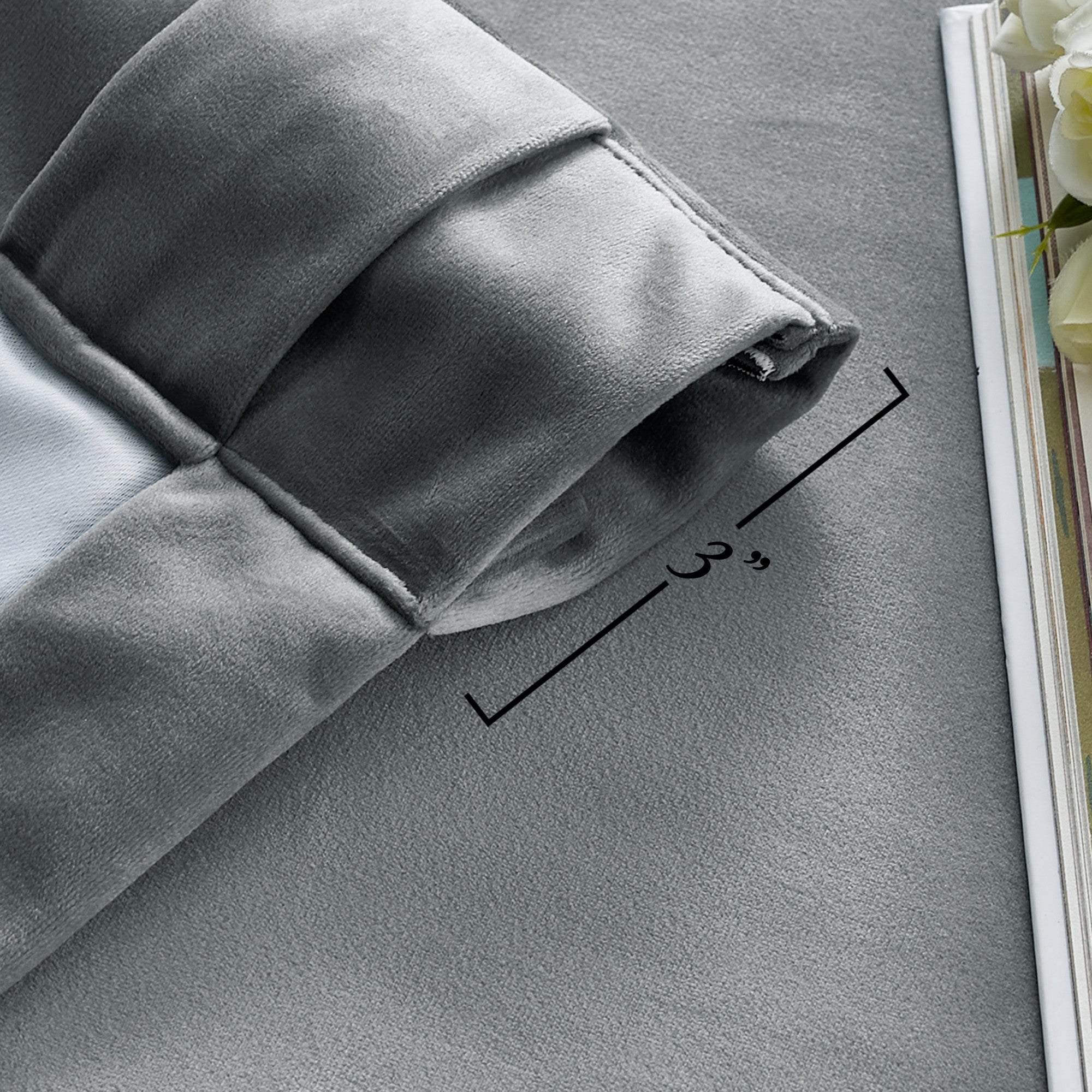 Close-up of a grey velvet thermal insulated light blocking curtain, highlighting the thick fabric and 3-inch rod pocket.