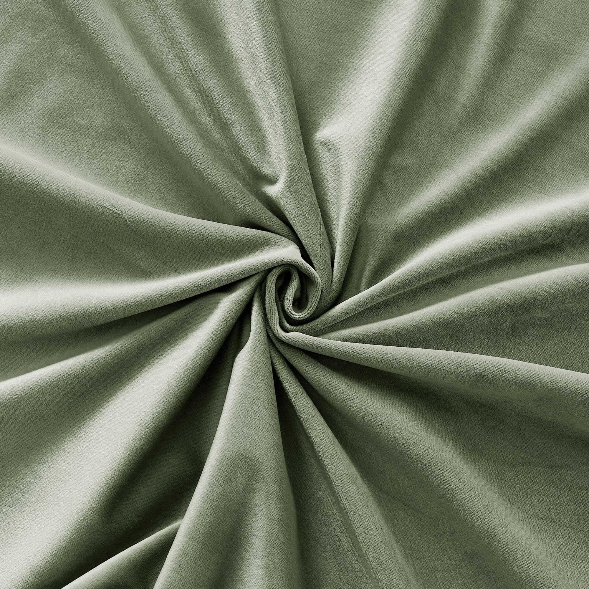 Luxurious green velvet thermal insulated curtain fabric, swirled to highlight its soft, thick, and light-blocking texture.