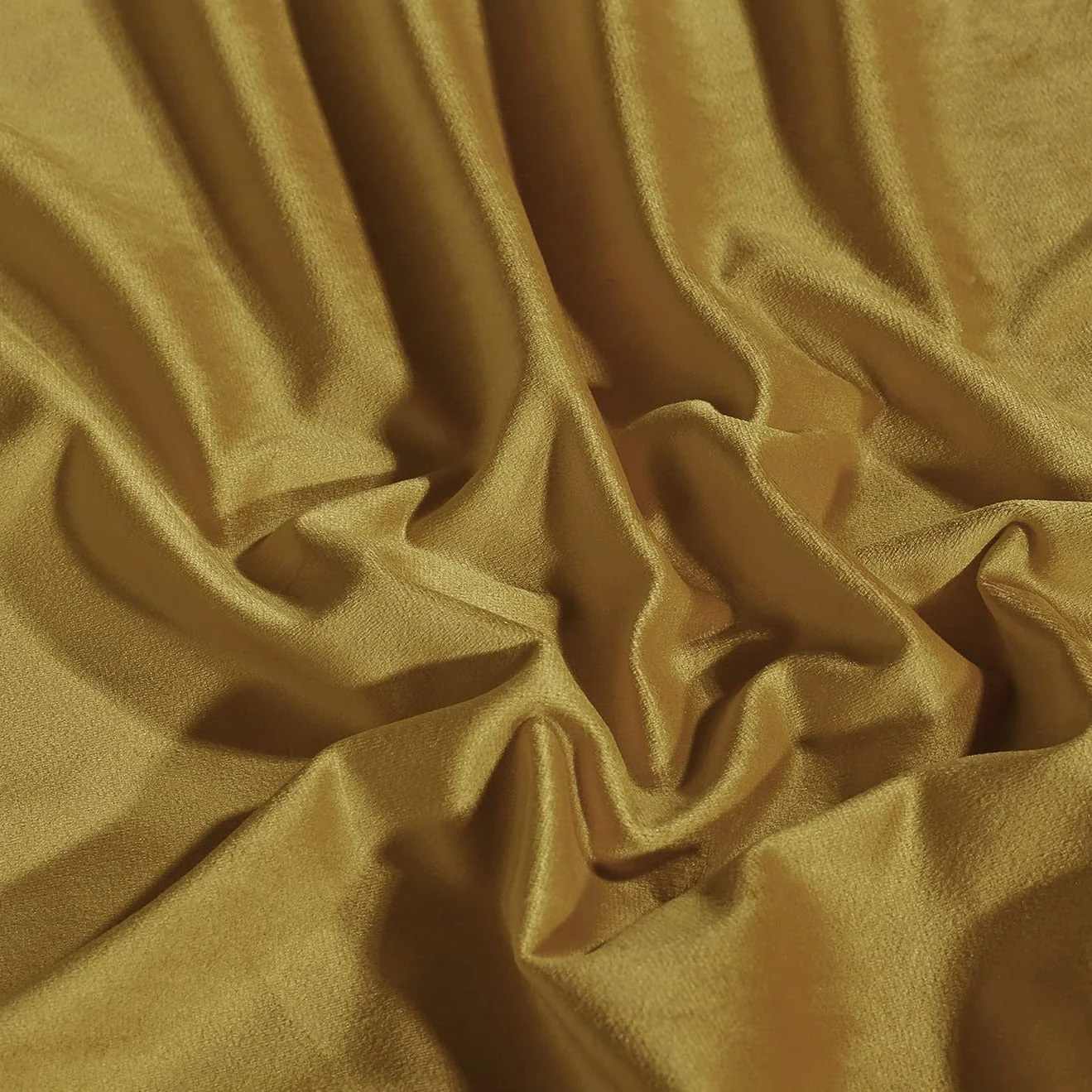 Close-up of draped golden yellow velvet fabric, showcasing the soft texture and luxurious sheen of the curtain sample.