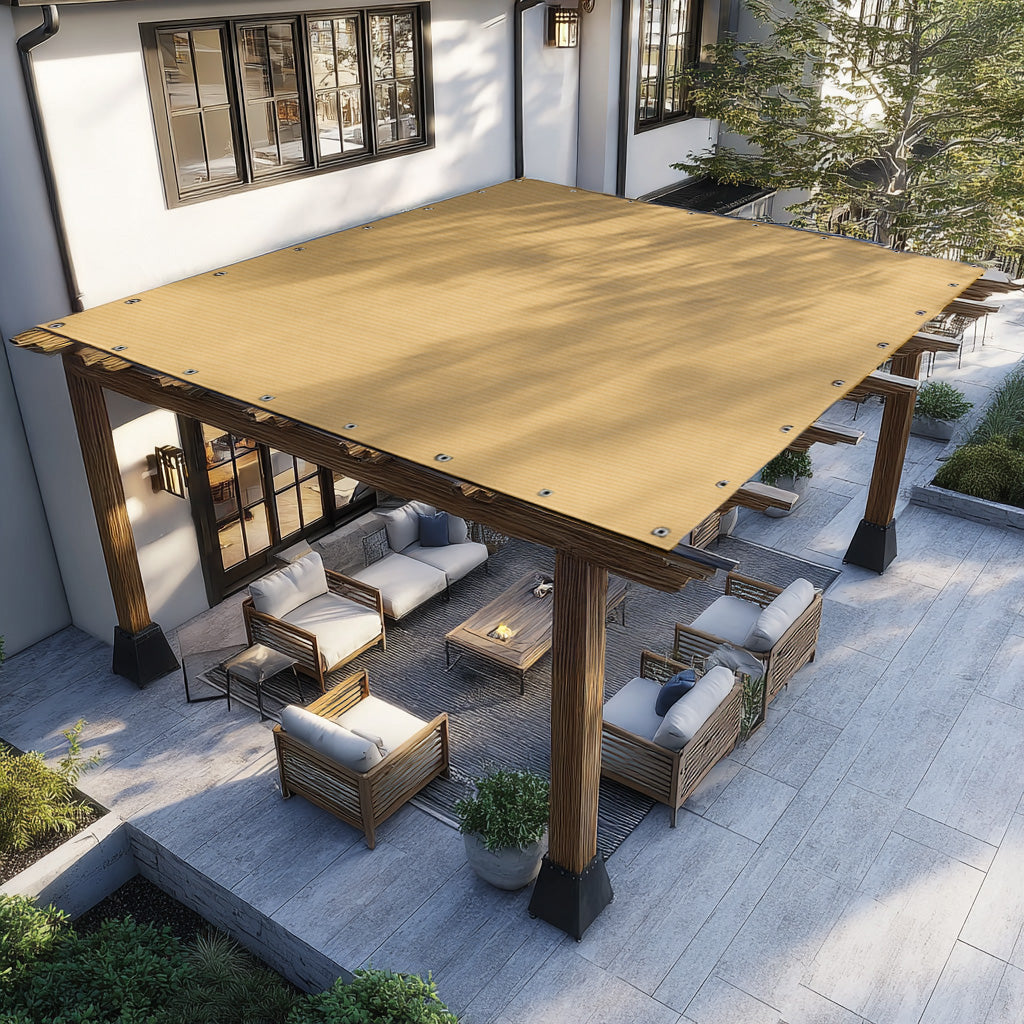 Tan HDPE breathable shade sail with visible grommets covers a wooden pergola over a modern outdoor patio.