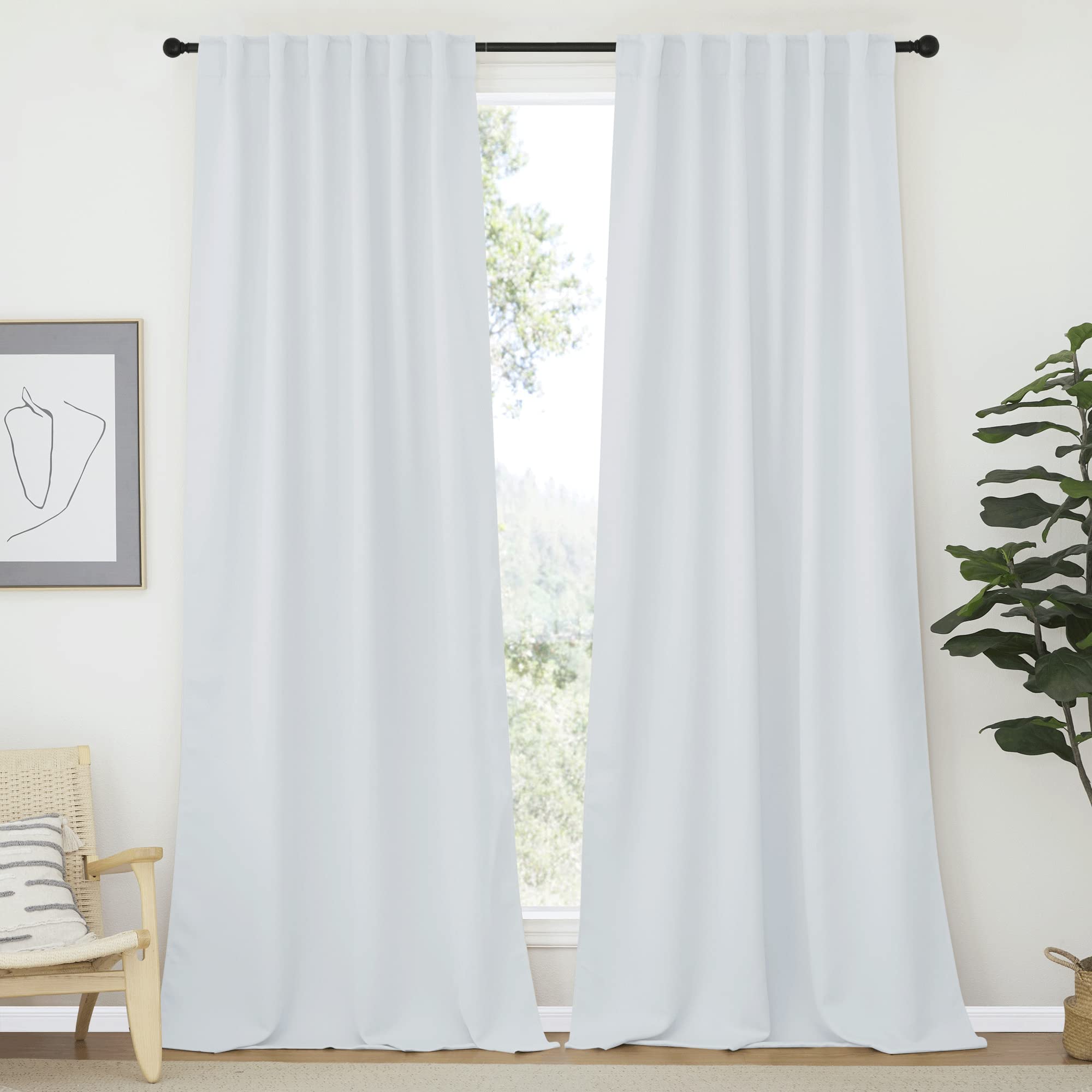 Two white rod pocket & back tab thermal insulated blackout curtains, 2 panels, for living room or bedroom window.