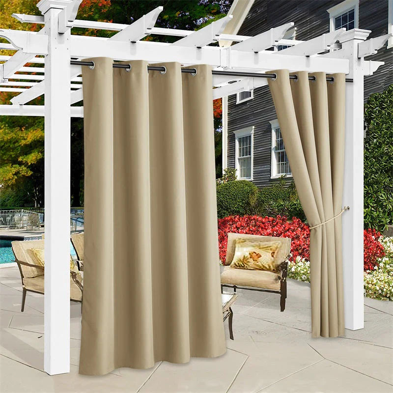 Beige weatherproof outdoor canvas curtains on a pergola, creating sun shade and privacy for a patio and pool area.