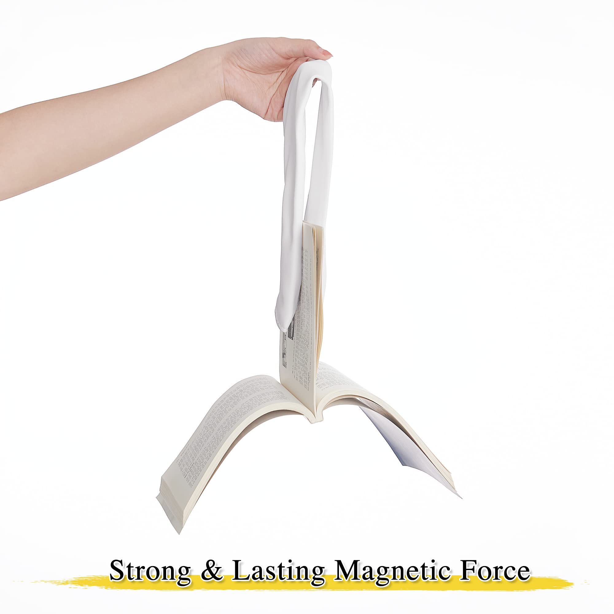 Strong white magnetic drape tie back supporting an open book, proving its lasting magnetic force for outdoor curtains.