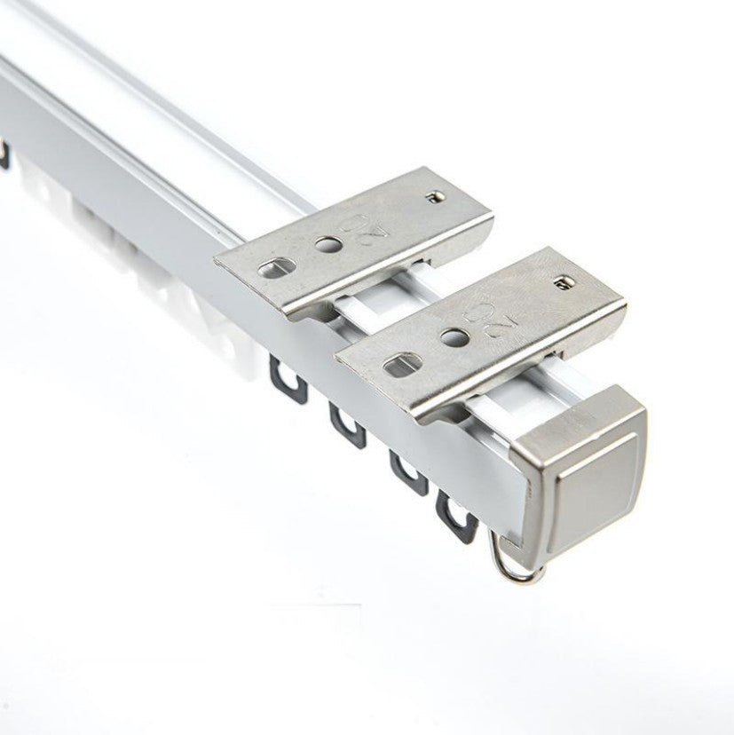 Heavy-duty silver metal curtain track with mounting brackets and gliders, ideal for custom outdoor curtains.
