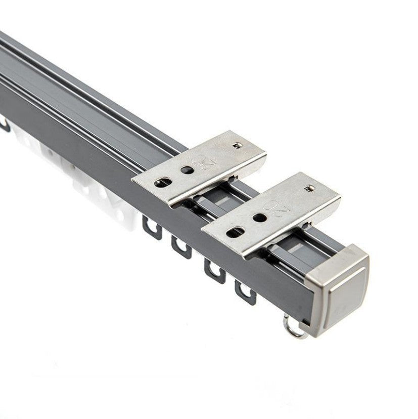 Gray custom heavy-duty metal curtain track, with white gliders and metal mounting brackets, for outdoor shade solutions.