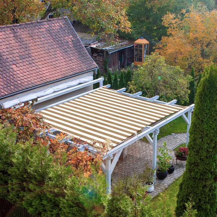 Beige & white striped waterproof UV block sun shade sail rectangle on a white pergola shading a backyard patio.