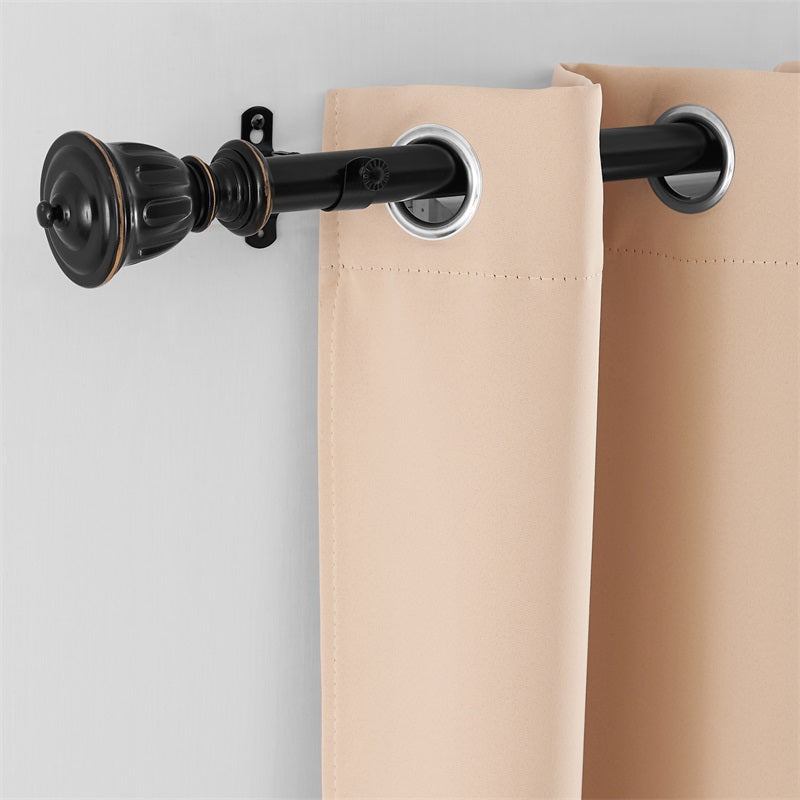 Close-up of black 1-inch rust-resistant outdoor curtain rod (72-144 inches) with ornate finial and beige grommet curtain.