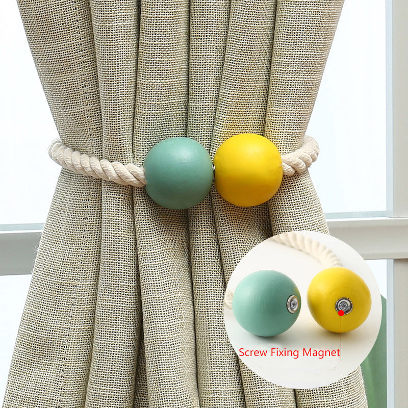 Decorative magnetic cotton hand-woven rope tieback with teal & yellow wooden balls securing a textured outdoor curtain. Inset shows screw-fixed magnet.