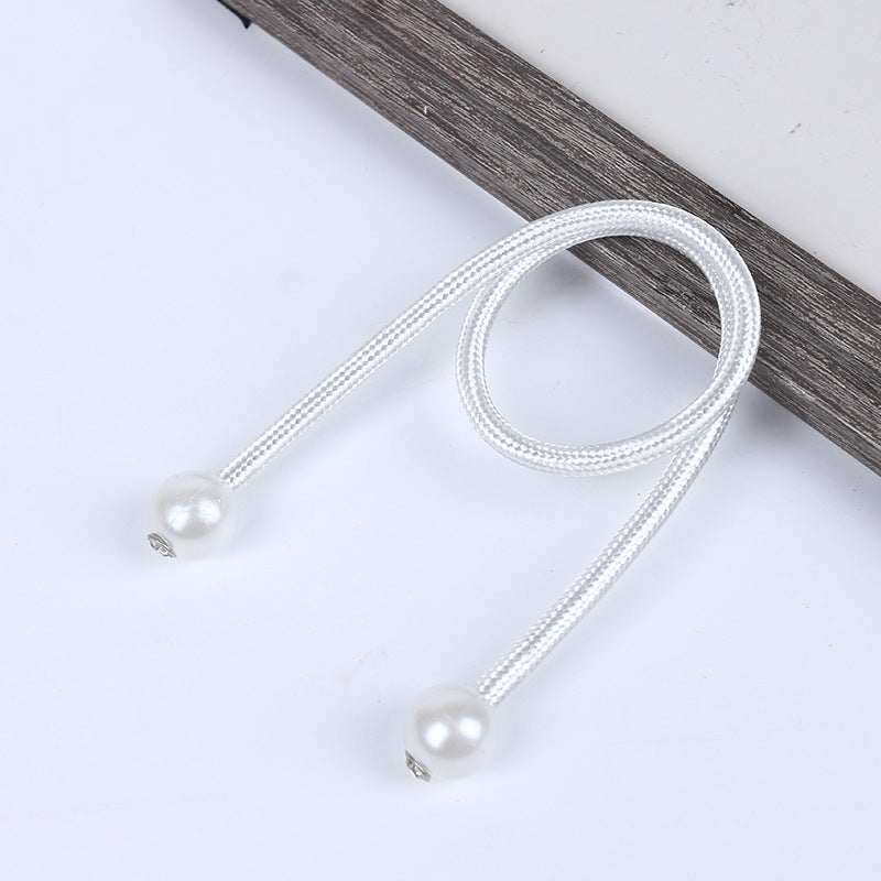 Stylish white braided curtain tieback with magnetic pearl ball ends for outdoor use