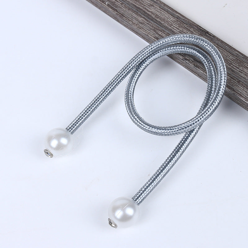 Single silver braided magnetic curtain tieback strap with pearl balls, designed for outdoor patio & pergola curtains.