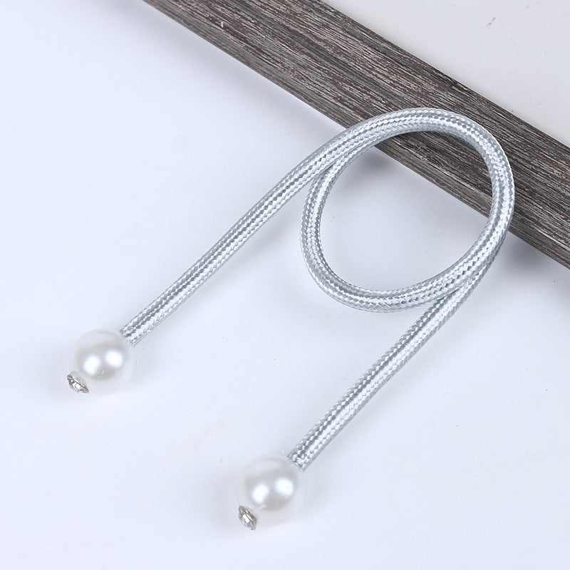 Silver braided magnetic curtain tieback featuring two white pearl balls, ideal for outdoor patio and pergola curtains