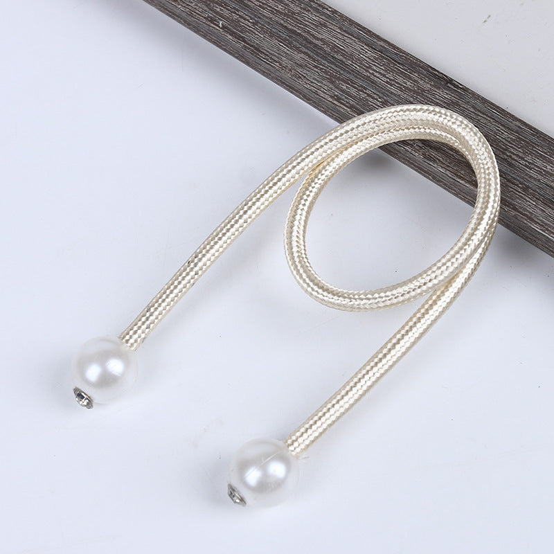 Elegant light gold braided magnetic curtain straps tiebacks with decorative pearl balls, ideal for securing outdoor curtains.