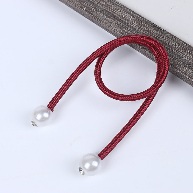 Dark red braided magnetic curtain tieback strap with two glossy white pearl balls