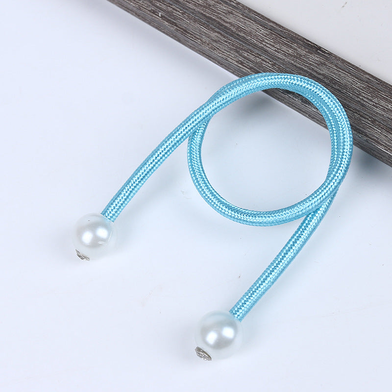 Light blue braided magnetic curtain tieback with elegant white pearl balls, perfect for securing outdoor or indoor curtains.
