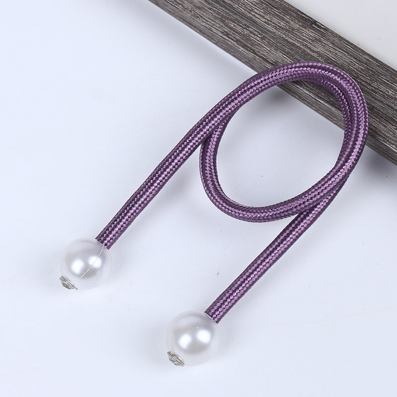 Purple braided magnetic curtain tieback with elegant pearl ball ends for outdoor shade solutions and patio curtains.