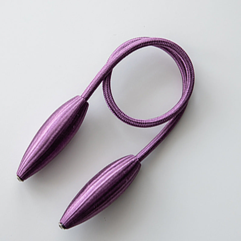 Purple curtain tieback with decorative ribbed spindle ends and a flexible braided cord for modern curtain decoration.
