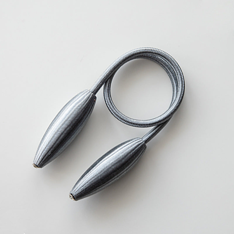 Modern gray magnetic curtain tieback with textured oblong ends, ideal curtain strap accessory for outdoor patio and pergola curtains.