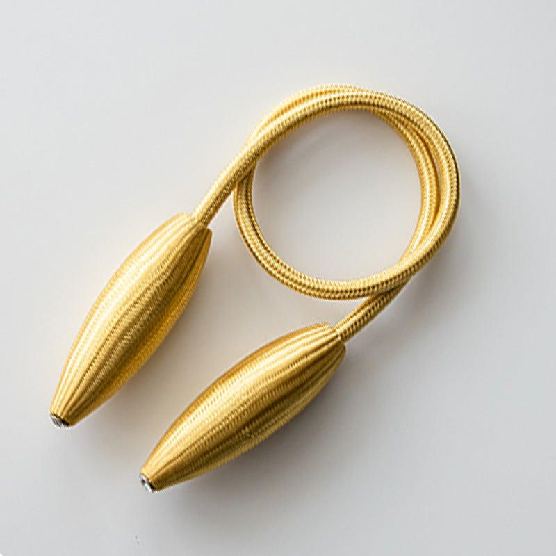 Modern gold buckle curtain tieback strap with textured ends & subtle crystal accents, ideal for securing outdoor/indoor curtains.