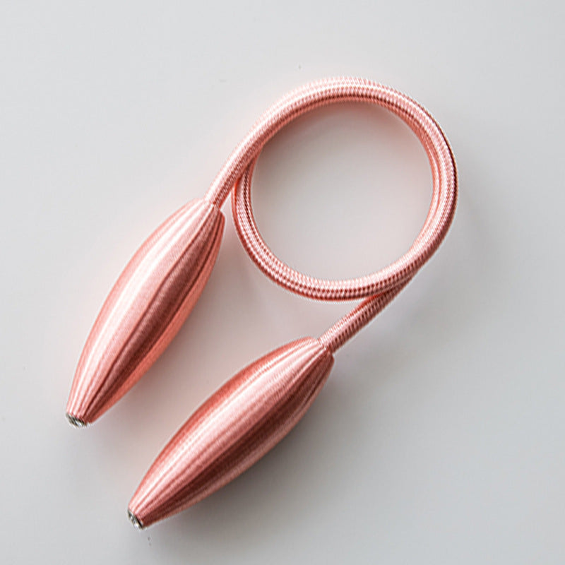 Rose gold simple modern curtain tieback with ribbed oval ends and flexible strap, a buckle curtain decoration accessory.