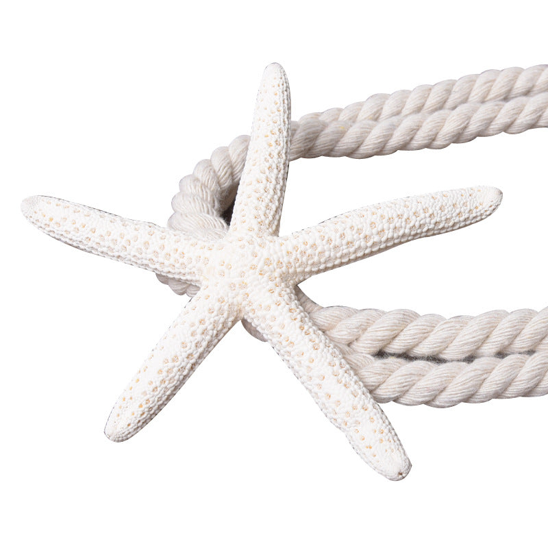 Natural white starfish decoration with textured surface on a twisted white rope for curtain tieback straps