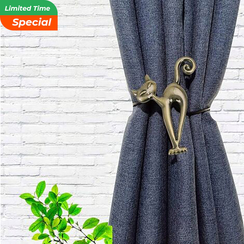 Elegant gold cat magnetic curtain tieback secures a pleated navy outdoor curtain, perfect for patio or pergola decor.
