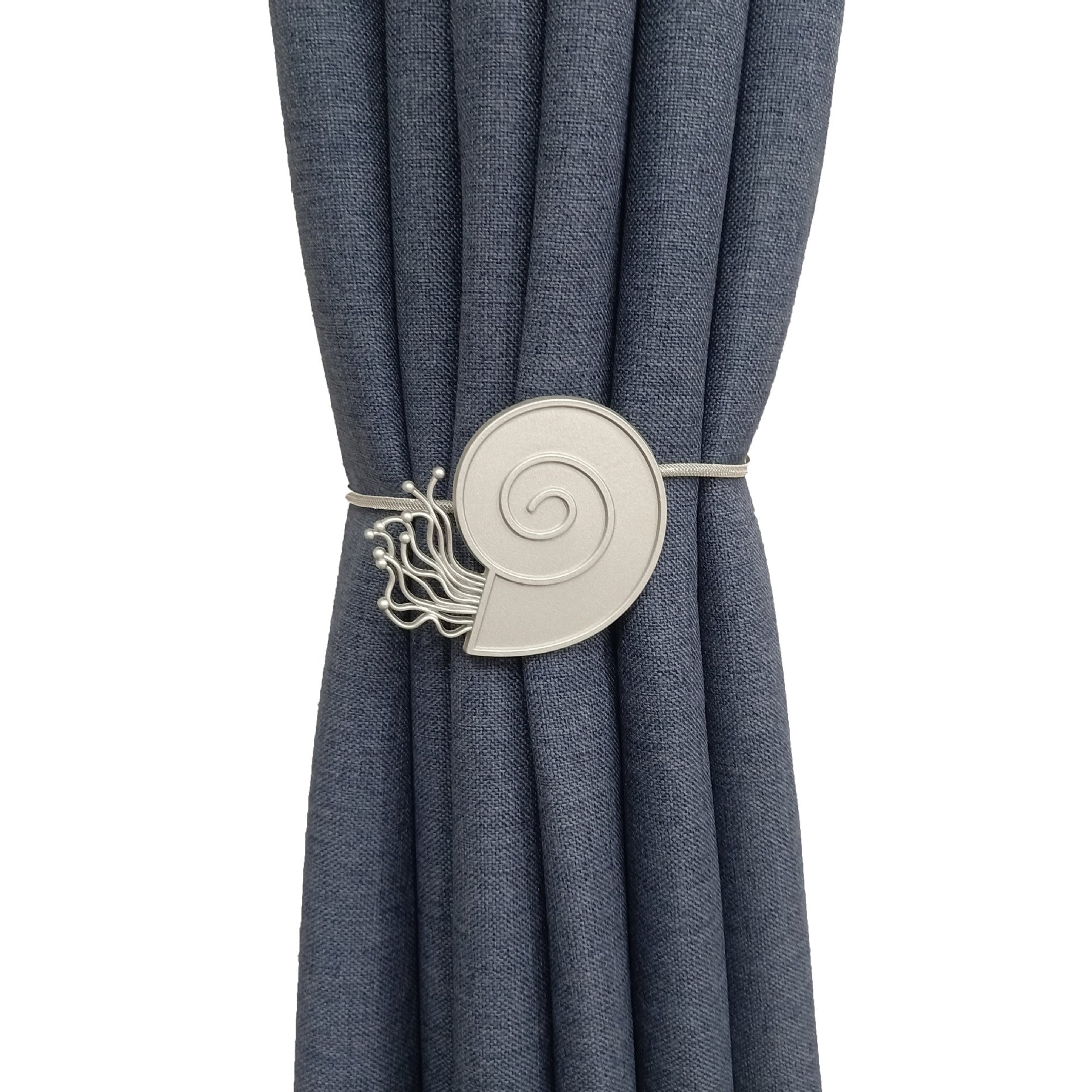 Elegant silver nautilus shell magnetic tieback holding a textured blue outdoor curtain. Stylish patio & pergola decor.