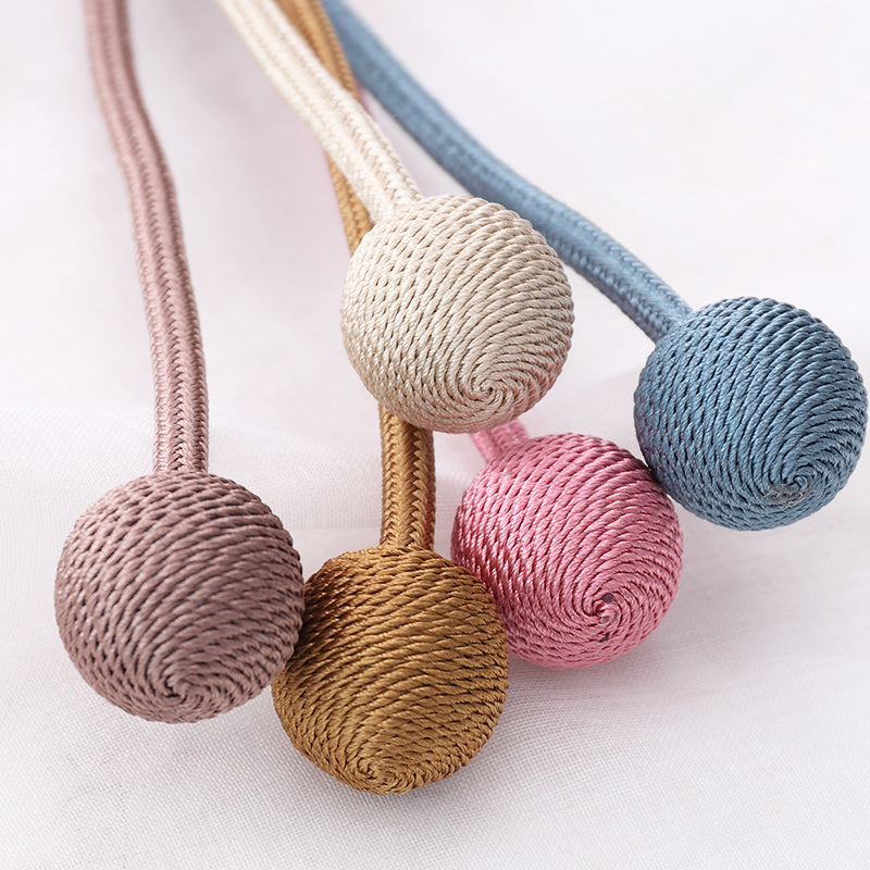 Modern simple Kgorge curtain tiebacks with braided cords and spherical ends in blush pink, light gold, cream, & sky blue.