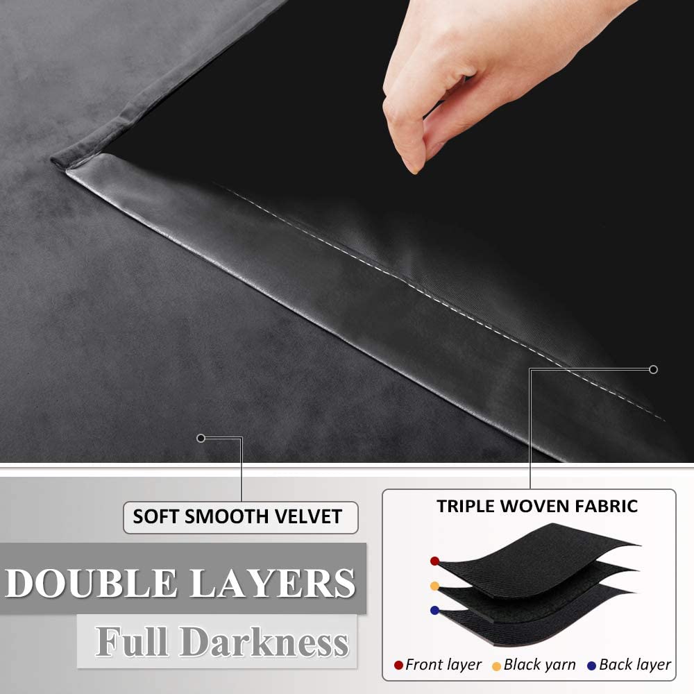 Hand demonstrating soft gray velvet drapes with double layers and triple woven blackout lining for ultimate darkness.