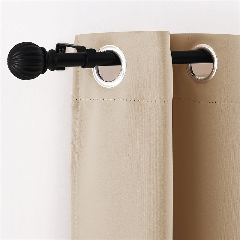 Black adjustable outdoor curtain rod with ribbed petal ball finial, holding beige weatherproof grommet curtain.