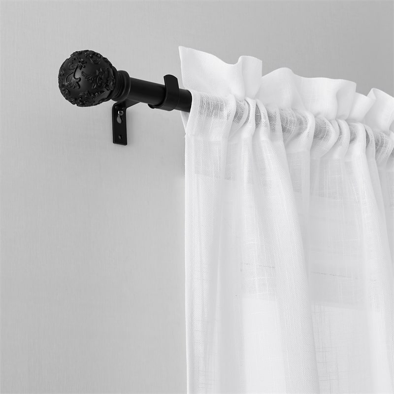 Close-up of black adjustable extra-long outdoor curtain rod with ornate petal ball finial and white rod pocket curtain.