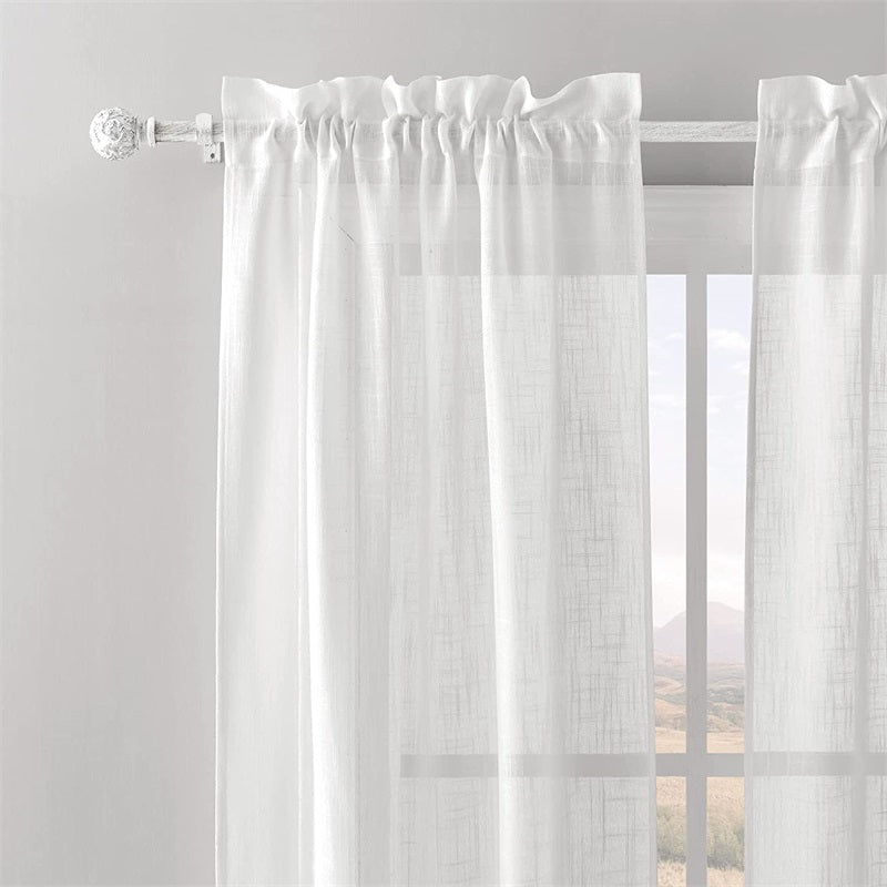 White adjustable outdoor curtain rod with decorative petal ball caps holding sheer weatherproof outdoor curtains for patio or pergola.