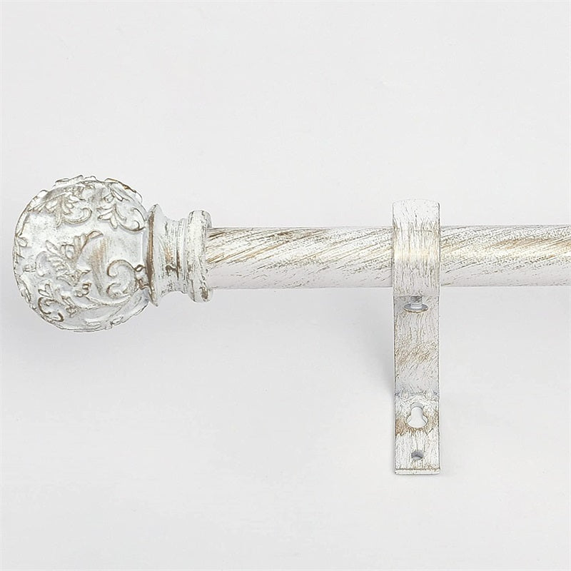 Distressed white extra-long outdoor curtain rod with ornate petal ball cap and mounting bracket for patio or pergola areas.
