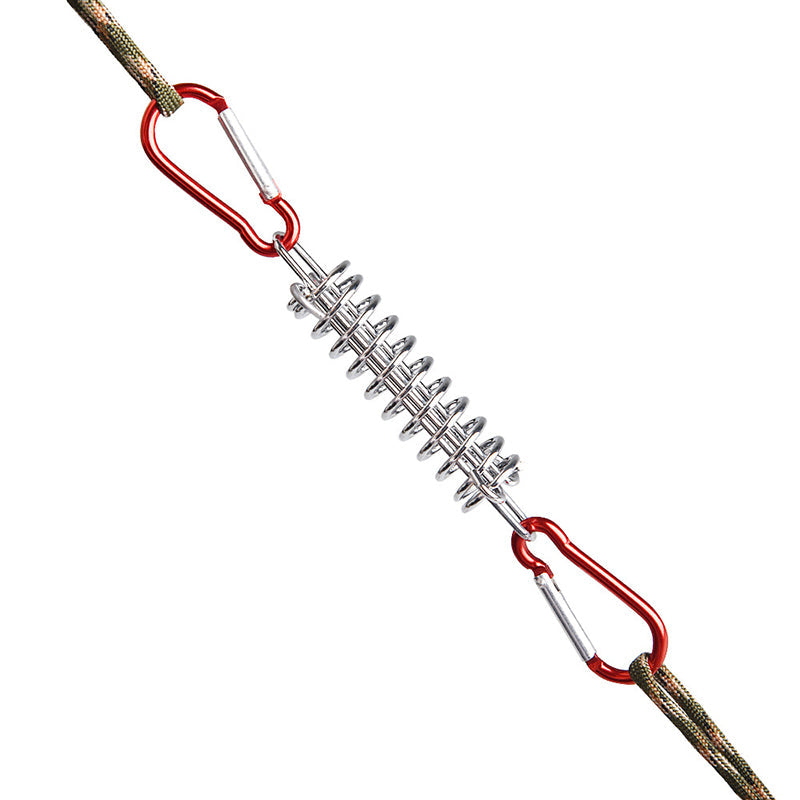 Durable metal tension spring with red carabiners and camouflage rope, designed for securely fixing outdoor awnings, canopies, and tents.