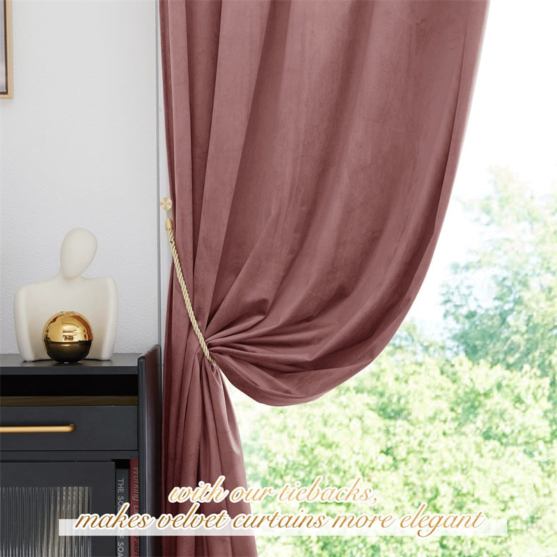 Luxury mauve velvet curtain panel tied back with gold rope, showcasing privacy & thermal insulation against a bright window.