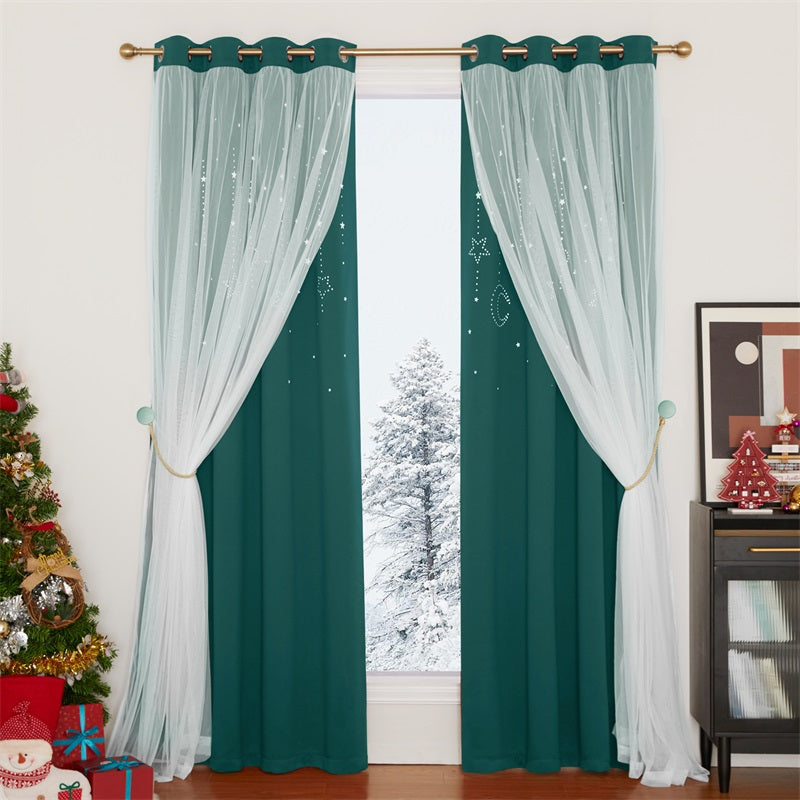 Two teal blackout curtains with moon & star cut-outs and white sheer star overlay, tied back revealing a snowy window.