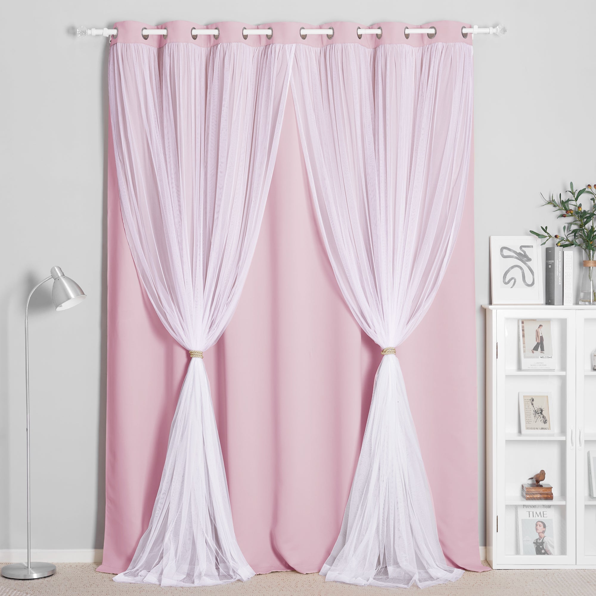 Pink blackout woven curtain with white crushed voile sheer overlay, grommet top, tied back for room darkening & privacy.