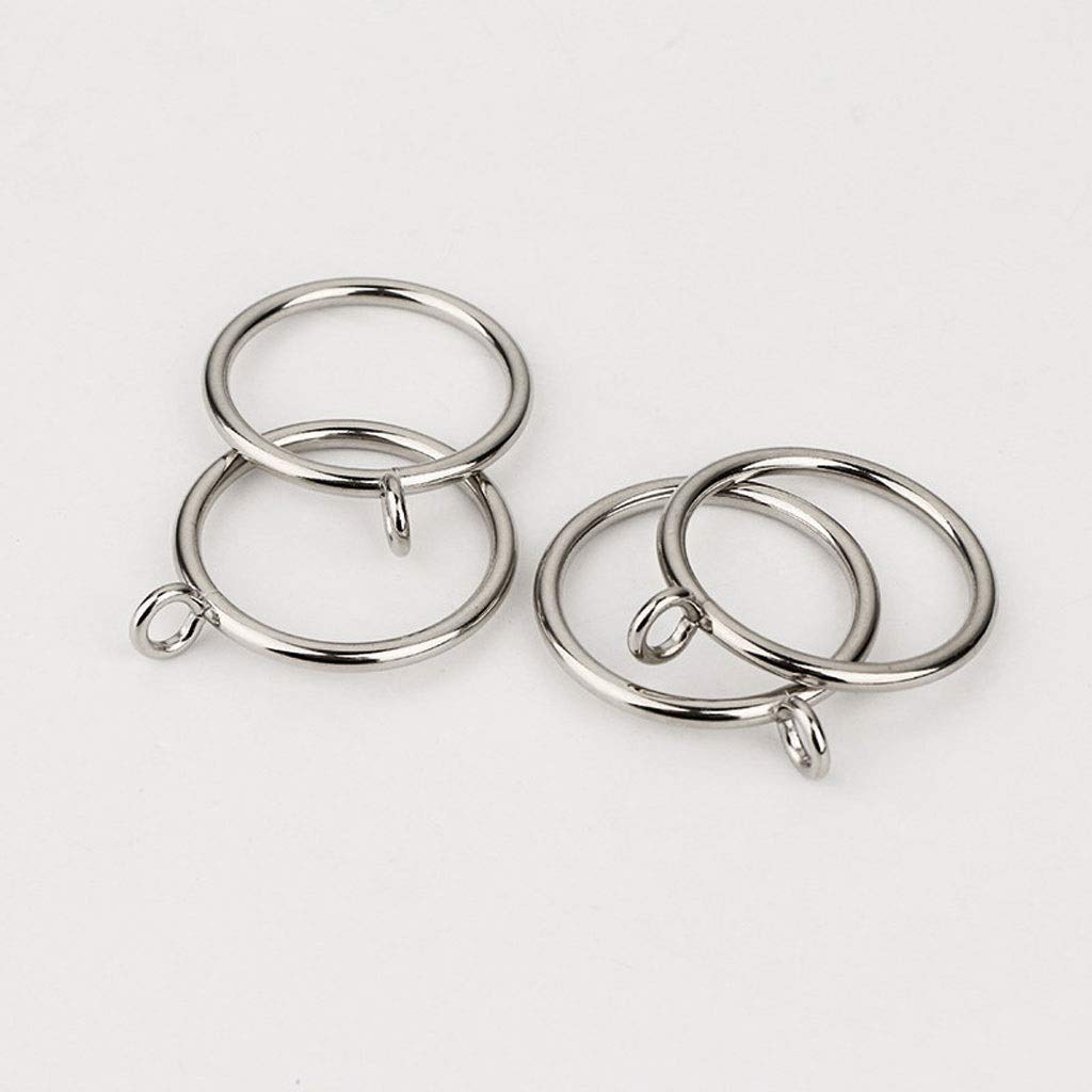 Close-up of two sets of polished silver metal curtain rings with eyelet hooks for hanging bedroom or living room curtains.
