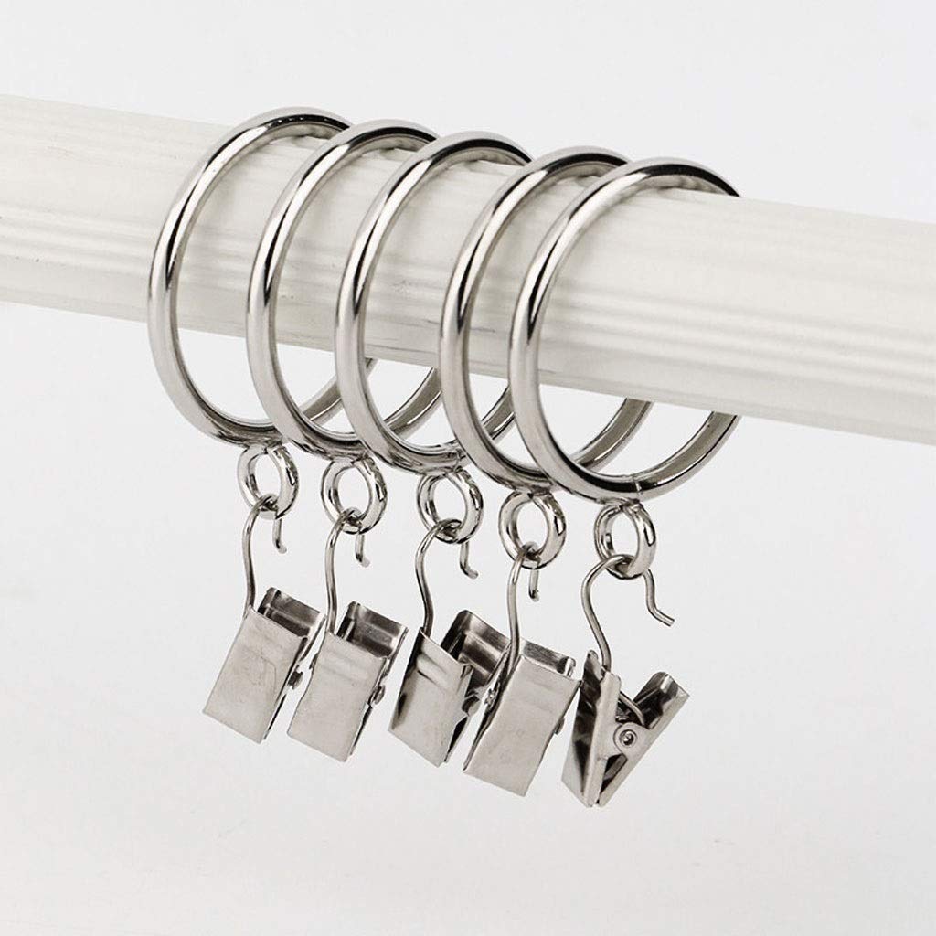 Five polished silver metal curtain rings with clips, securely hanging on a white rod for bedroom & living room curtains.